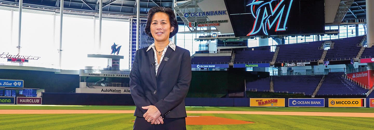 Kim Ng standing on the field of the Miami Marlins&apos; stadium