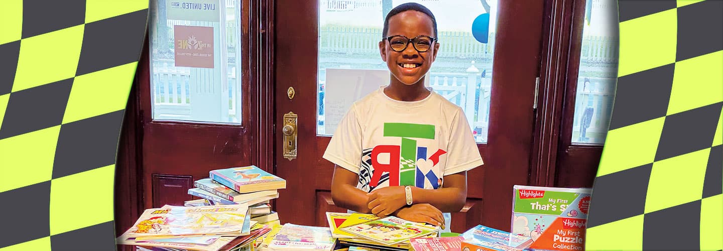 Student organizing books to be donated