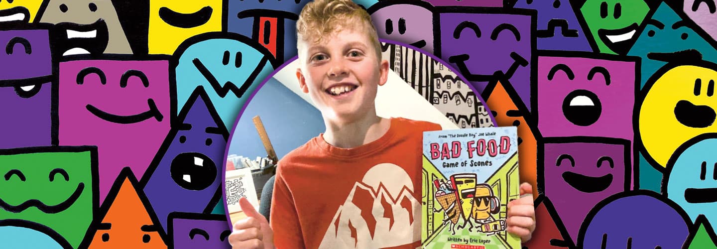 Eric Luper smiles and holds a book titled bad food.