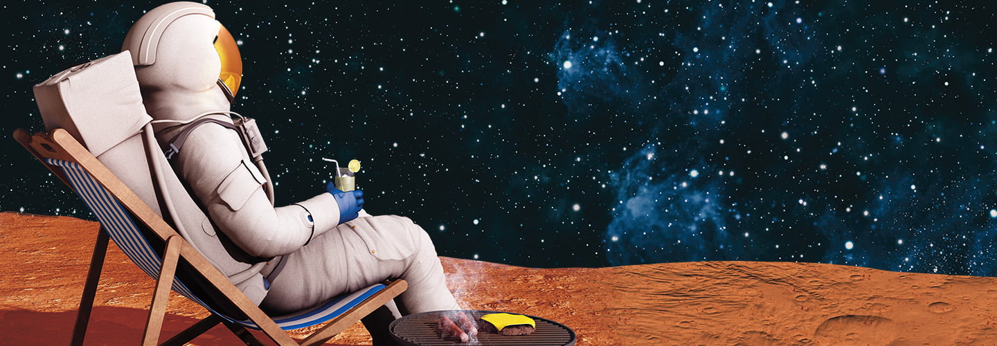 Image of an astronaut on mars while sitting on a chair with a drink in hand and a beachball nearby