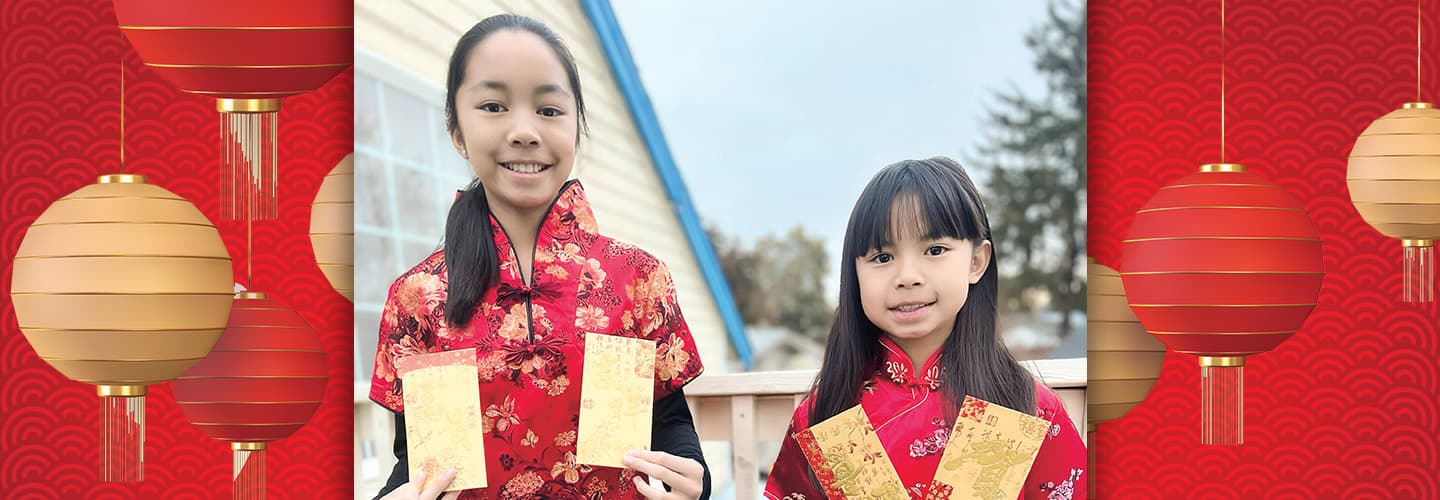 Image of two kids celebrating Chinese New Year with red chinese lanterns as the border on the image