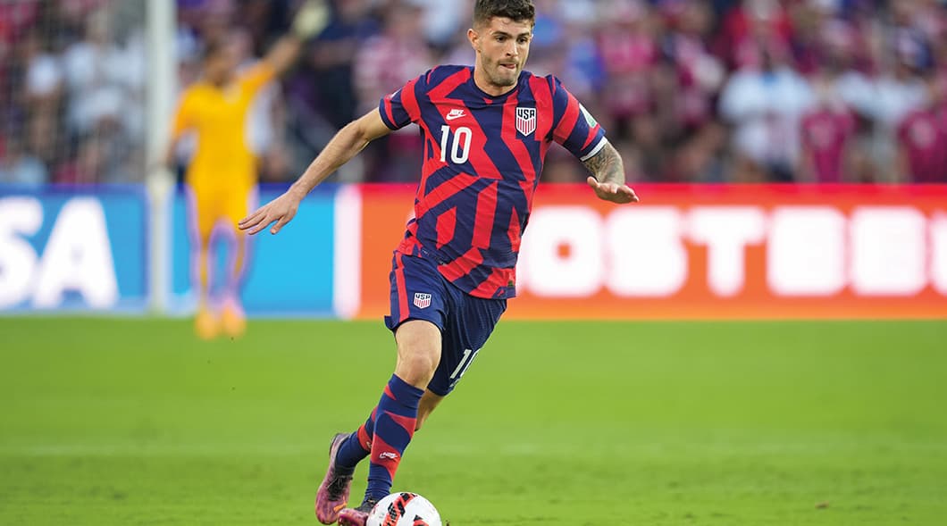 Photo of a professional soccer player dribbling the ball