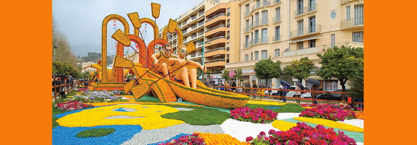 Photo of a huge giant arrangement of oranges transformed into people rowing a boat