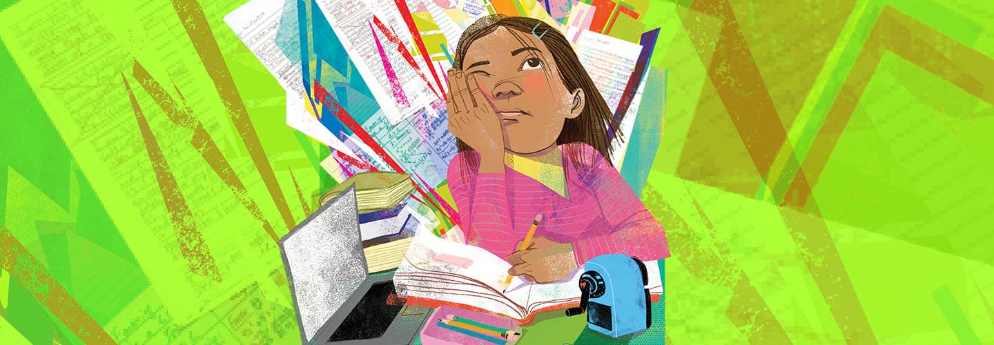 A girl in a pink shirt sits at a desk with an open book, looking up thoughtfully