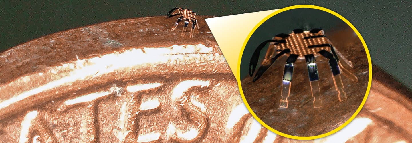 Zoomed in image of a tiny robot walking on a penny